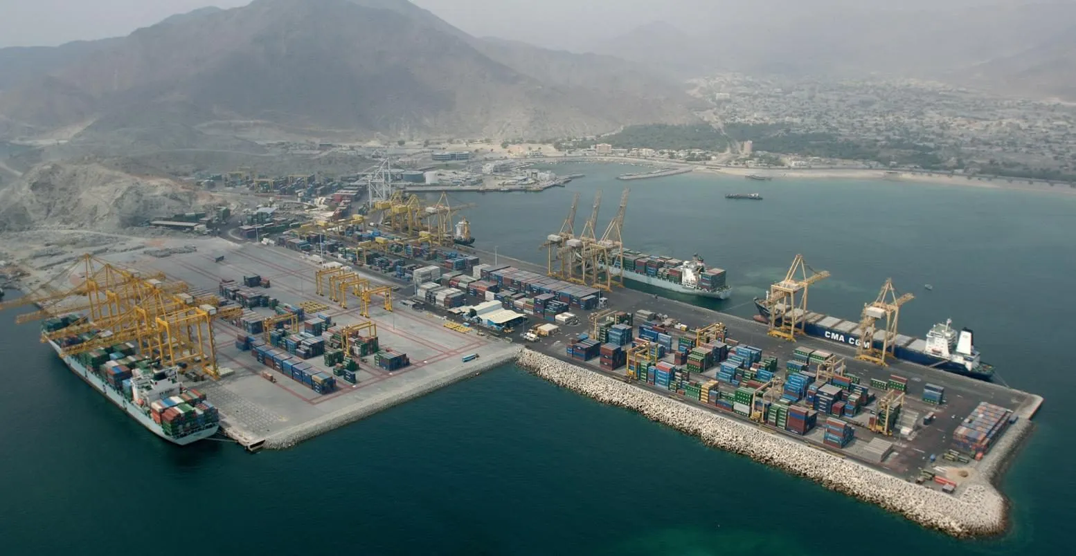 Khor Fakkan port and container terminal with the Hajar mountains behind