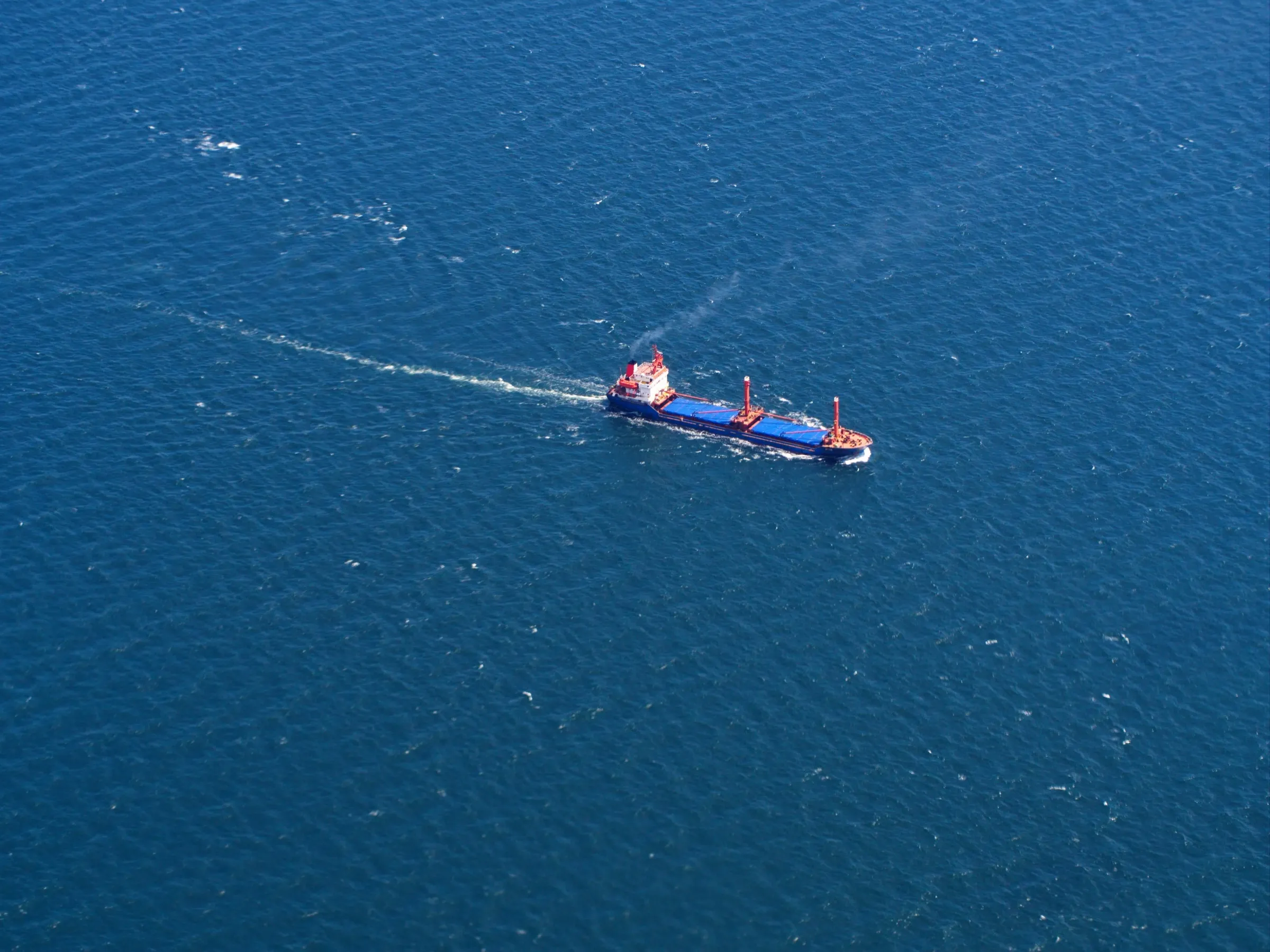 Cargo ship under way in open water