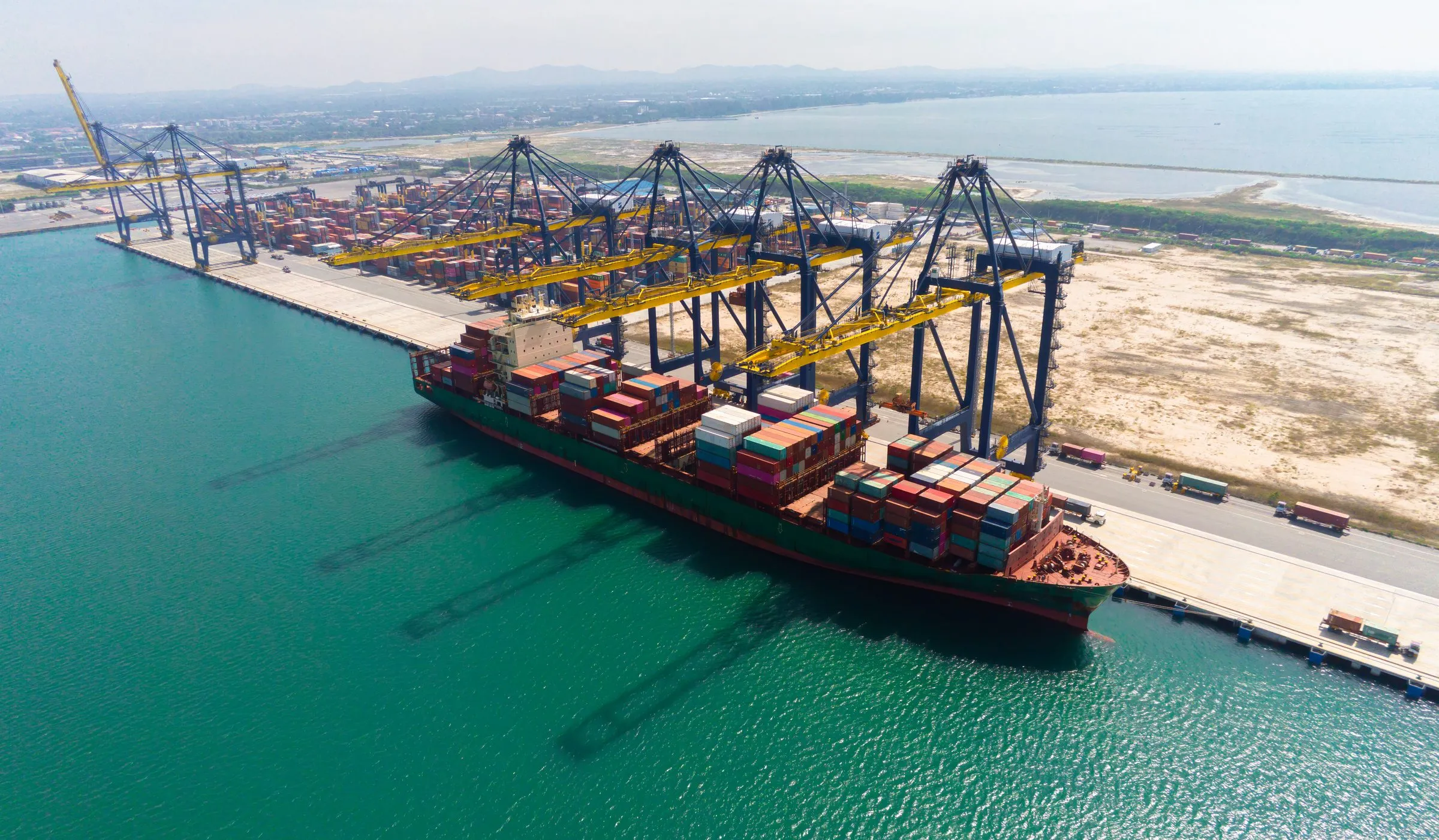 Container vessel alongside a gantry-crane terminal, aerial view